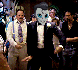 a man in a tuxedo with a cartoon mask on his face