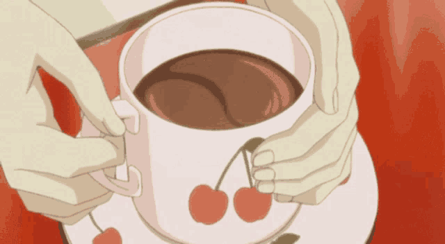 a person holding a cup of coffee with cherries on the saucer