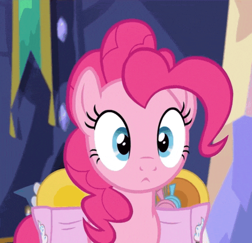 pinkie pie from my little pony is reading a book with wings on it