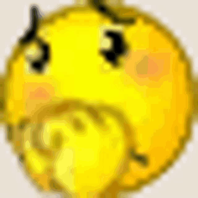a close up of a yellow smiley face with a hand on its mouth .