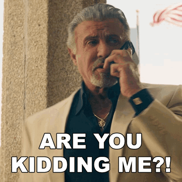 a man talking on a cell phone with the words " are you kidding me " below him