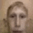 a blurry picture of a man 's face with a very large nose .