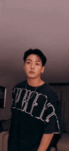 a young man wearing a black t-shirt that says nike