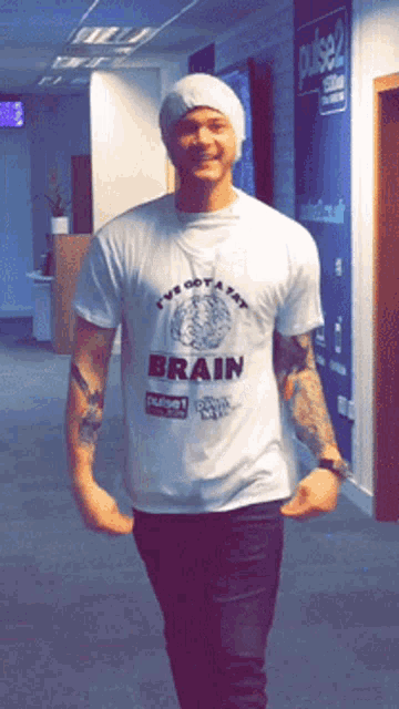 a man wearing a t-shirt that says brain
