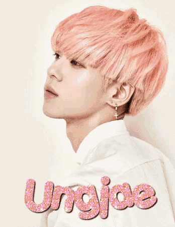 a young man with pink hair has the name ungjae written in pink glitter