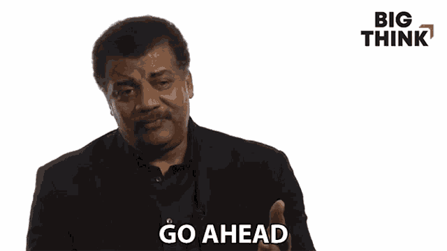 a man in a suit is saying " go ahead "