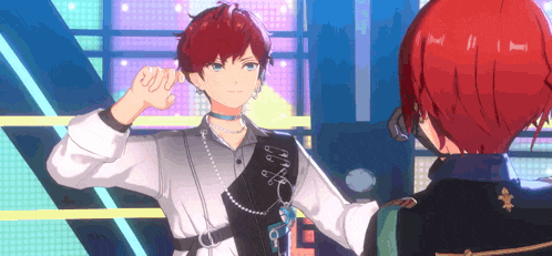 two anime characters are standing next to each other on a stage and one of them has red hair .