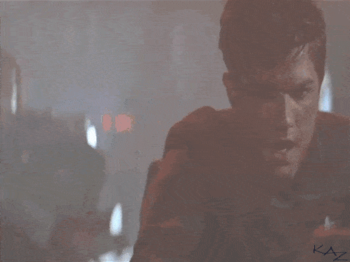 a blurry picture of a man with the words what do we say to the god of death
