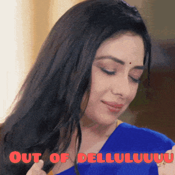 a woman in a blue saree with the words out of dellu written on the bottom