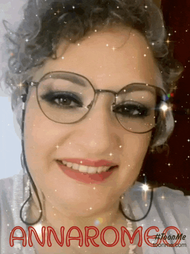 a woman wearing glasses has the name annarome written in red