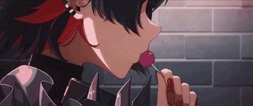 a girl with red hair is licking a pink lollipop .