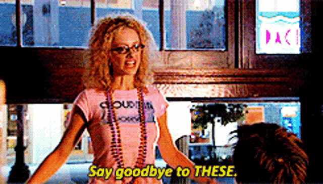 a woman in a pink shirt says goodbye to a man