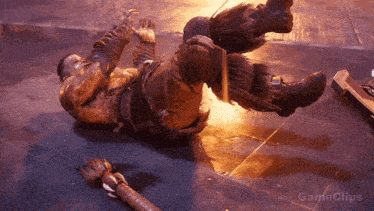 a man is laying on the floor with gameclips written in the corner