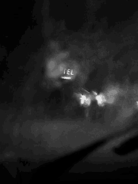 it is a black and white photo of smoke coming out of a pipe .