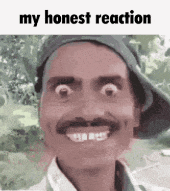 a man with a mustache and a hat is smiling with the words my honest reaction below him