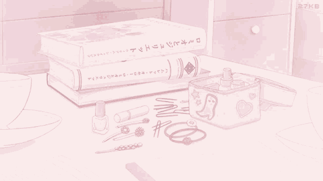 a pink box with a ghost on it sits on a table next to books