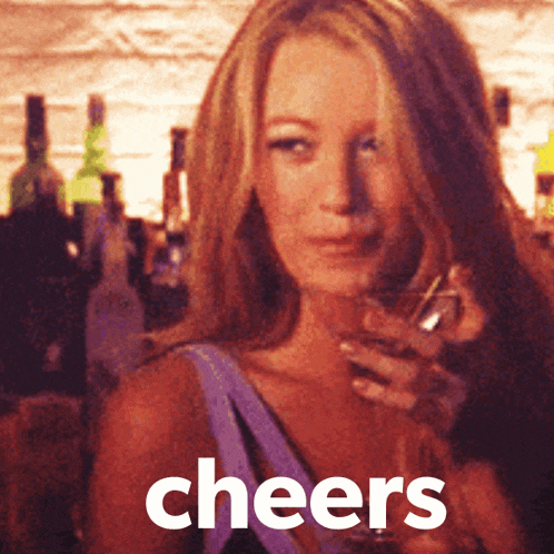 a woman is holding a glass of wine and the word cheers is on the bottom
