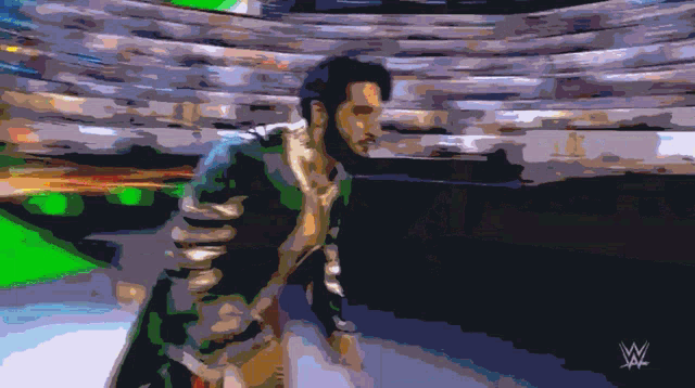 a pixelated image of a man with a w logo on the bottom right