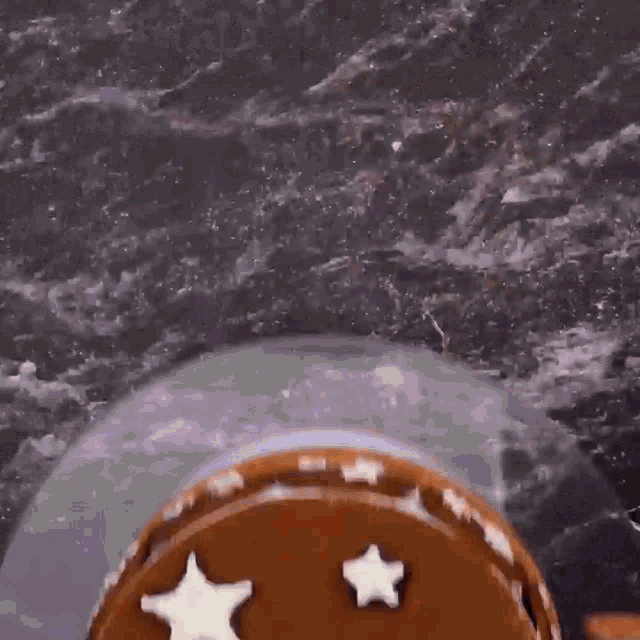 a cake with cookies and stars on it
