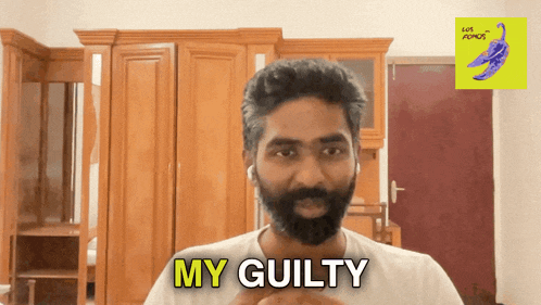 a man with a beard says my guilty in front of a wardrobe
