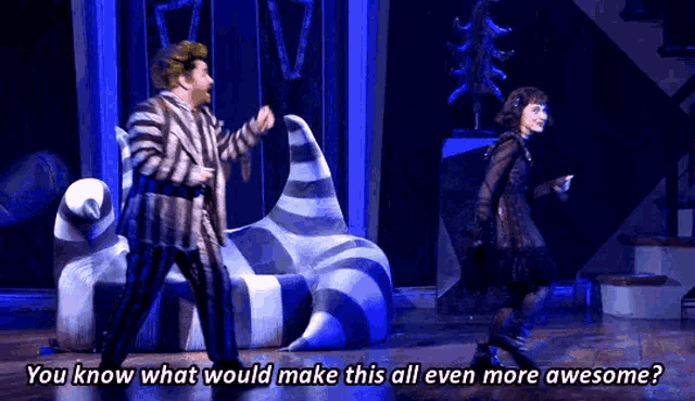 a man and a woman are dancing on a stage in a musical .