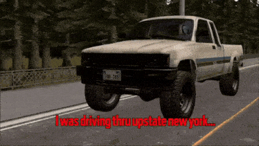 a white truck is driving down a road with the words i was driving thru upstate new york