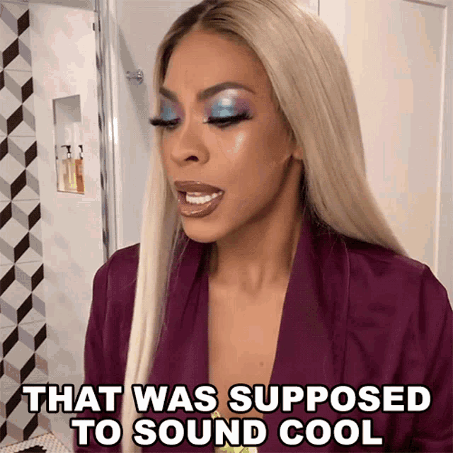 a woman says that was supposed to sound cool while wearing makeup