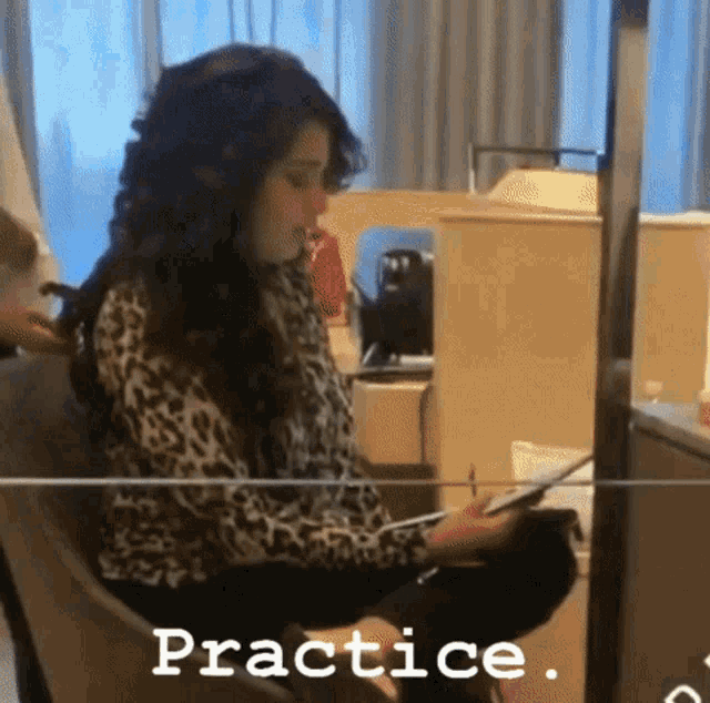 a woman in a leopard print shirt is sitting in a chair with the word practice written on the bottom