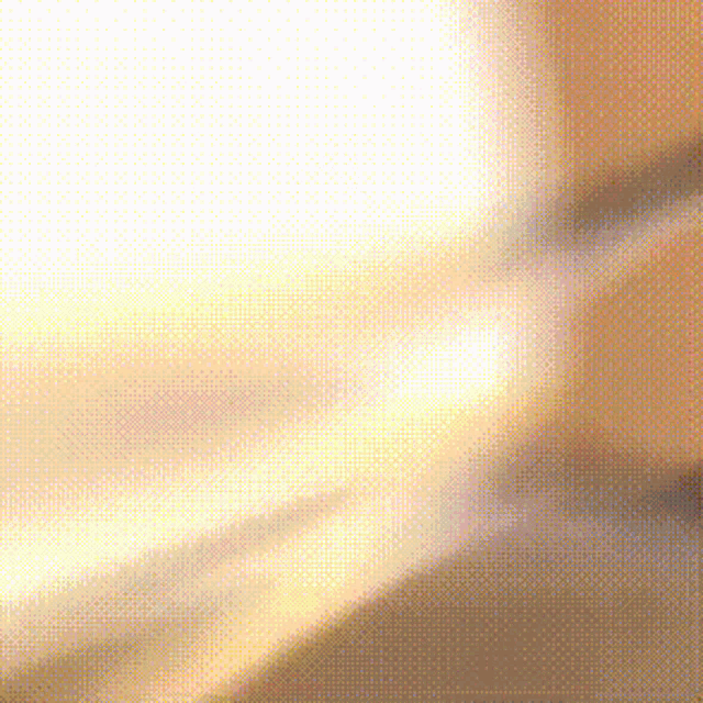 a blurred image of a person 's face with the sun behind them