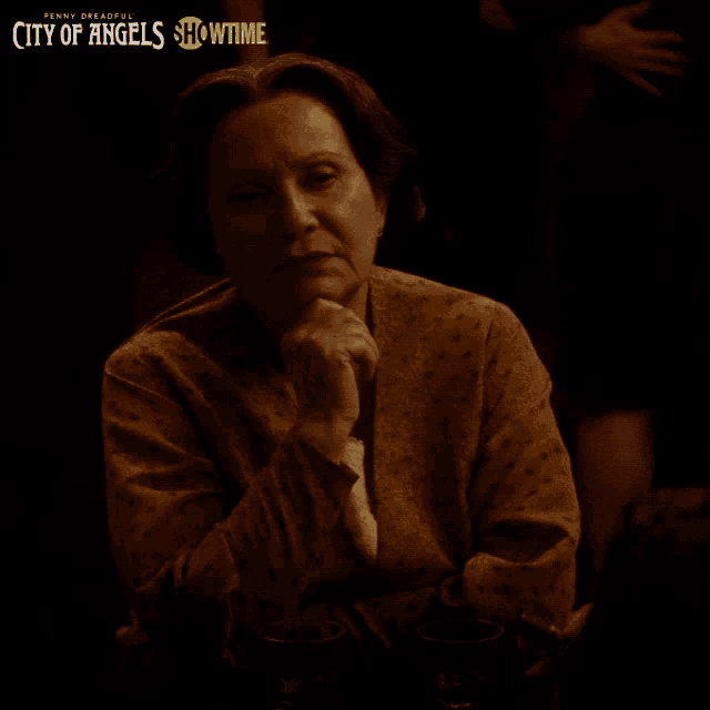 penny dreadful city of angels showtime poster with a woman sitting at a table