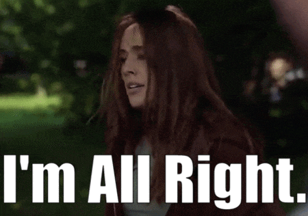 a woman says i 'm all right while standing in a park
