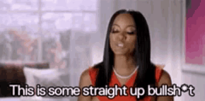 a woman in a red dress is making a funny face and says `` this is some straight up bullshit '' .