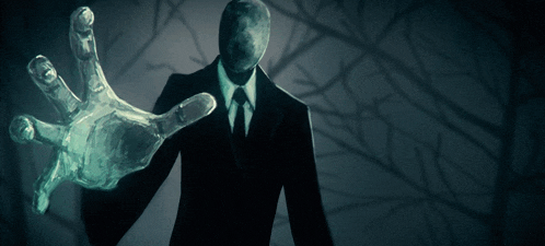 a man in a suit and tie is reaching out with his hand