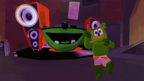 a green gummy bear stands in front of a purple speaker