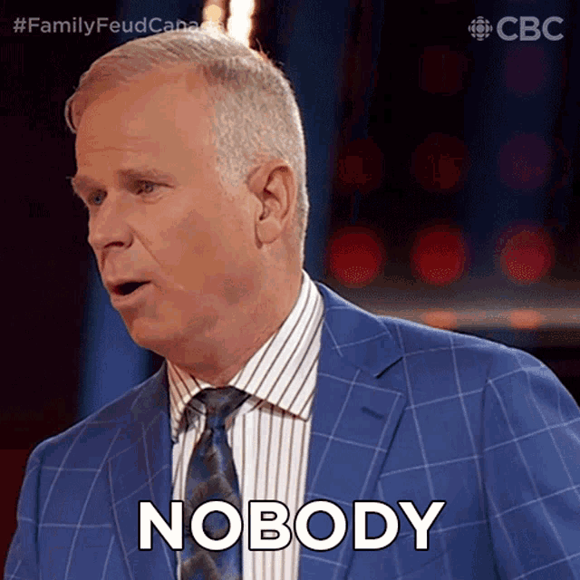 a man in a blue suit says nobody