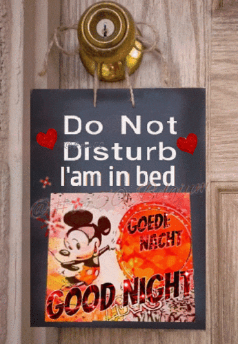 a sign on a door that says do not disturb i am in bed good night
