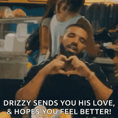 a man is making a heart shape with his hands and the words drizzy sends you his love hopes you feel better