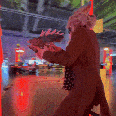 a person in a brown coat holding a stuffed animal in their hands