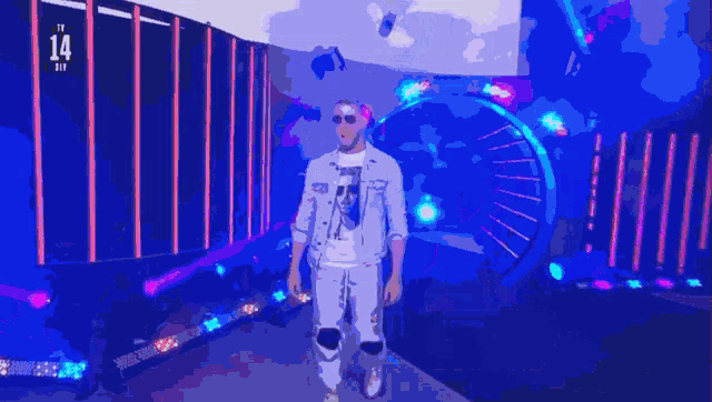 a man wearing sunglasses stands in front of a stage with the number 14 in the background