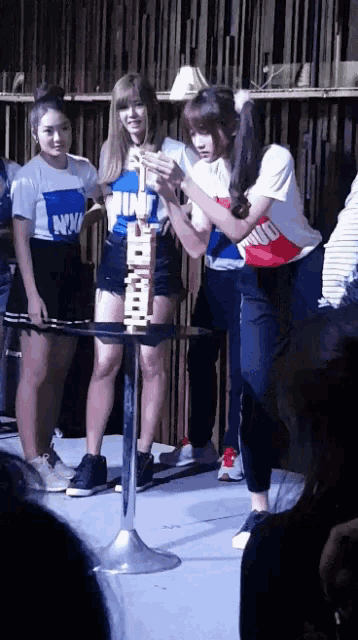 a girl wearing a shirt that says ' nm ' on it