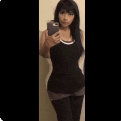 a woman taking a selfie with her phone