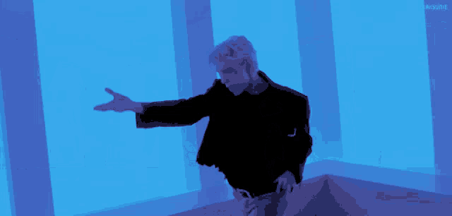 a man and a woman are dancing in a room with a blue background and the word awesome on the bottom