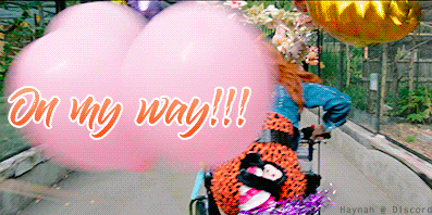 a woman in a wheelchair is riding a bike with balloons and the words on my way written on the bottom