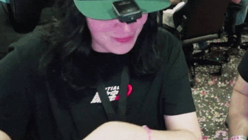 a woman wearing a hat and a t-shirt that says trial