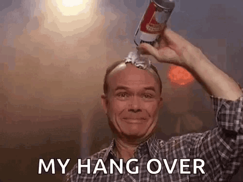 a man is holding a can of beer over his head and says `` my hang over '' .