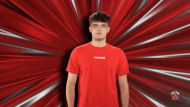 a man wearing a red t-shirt with the word tribe on it