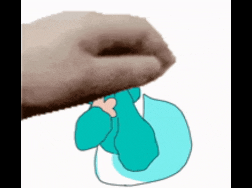 a hand is holding a drawing of a person in a blue shirt