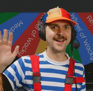 a man wearing headphones and a hat with the words wheel of wacky on it