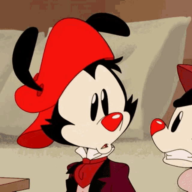 a cartoon character wearing a red hat and tie