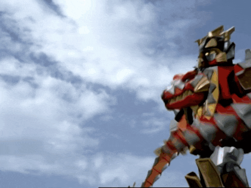 a robot is flying through the air with a blue sky in the background